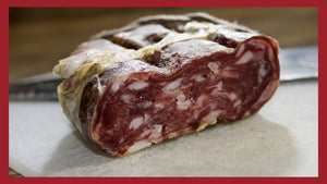 A close up of the the cross section of soppressata salami.
