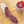 Load image into Gallery viewer, il porcellino salumi's black truffle salami pictured from above and cut into slices on a cutting board next to a jar of black truffle salt.