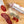 Load image into Gallery viewer, Two chubs of salami, one in packaging with &quot;Spanish Chorizo&quot; written on it and the other cut into slices, on a wood cutting board with herbs and spices between them.

