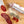 Load image into Gallery viewer, Two chubs of salami, one in packaging with "Spanish Chorizo" written on it and the other cut into slices, on a wood cutting board with herbs and spices between them.