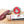 Load image into Gallery viewer, A product photo of il porcellino salumi's black truffle salami in packaging and cut into slices on a cutting board.