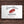 Load image into Gallery viewer, A picture of a gift card with the words "il porcellino salumi, Denver, CO" on it with a wood grain background.