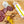Load image into Gallery viewer, A product photo of il porcellino salumi's Lemongrass Szechuan Peppercorn Salami shot from above. A chub of salami is on a cutting board next to salami slices, packaged salami, herbs and spices.
