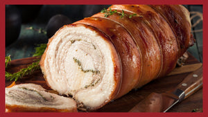A picture of porchetta roast on a cutting board with porchetta slices in the foreground.