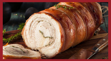 A picture of porchetta roast on a cutting board with porchetta slices in the foreground.