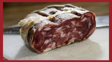 A close up of the the cross section of soppressata salami.