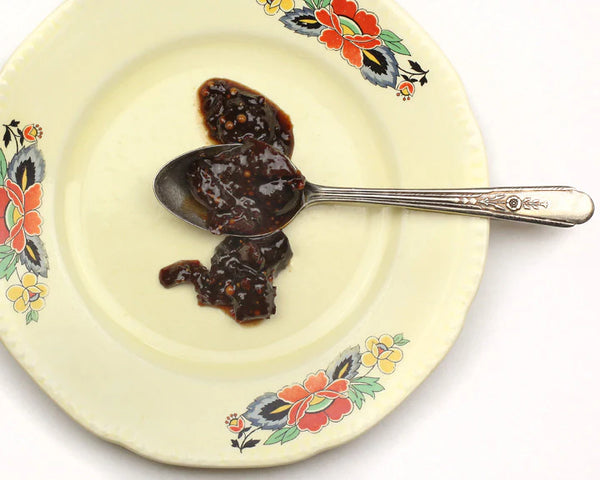 Spoon with Cherry Fig Mostarda from Redcamper on a decorative plate