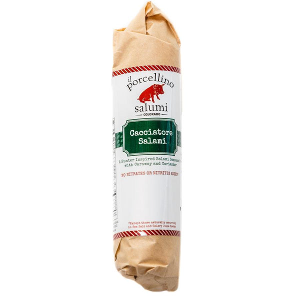 A product photo of il porcellino salumi's Cacciatore Salami in packaging with a white background.