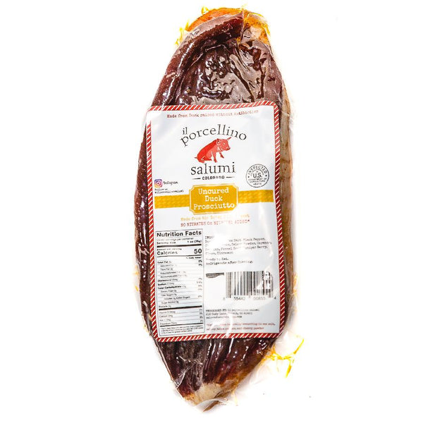 A product photo of il porcellino salumi's uncured duck prosciutto in packaging with a white background.
