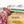 Load image into Gallery viewer, A close up picture of Finocchiona salami on a cutting board with herbs and spices. One salami is in packaging and the other is cut into slices.
