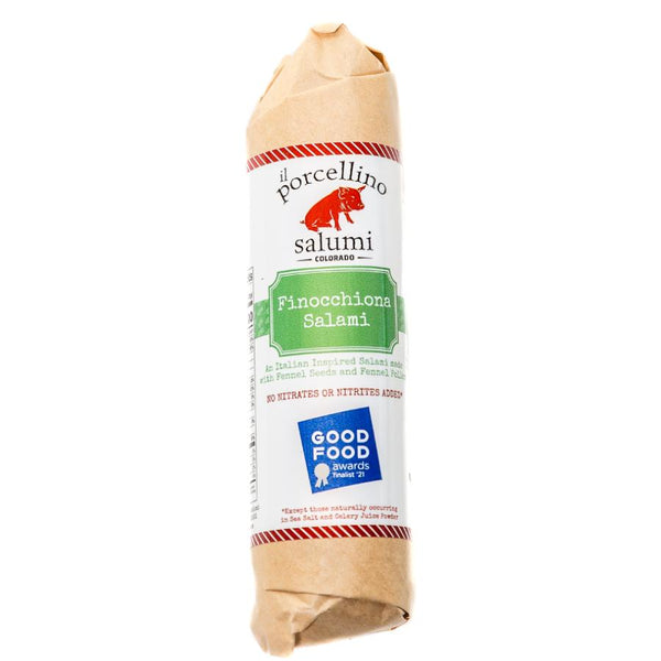 Finocchiona salami in packaging and staged for a product photo.