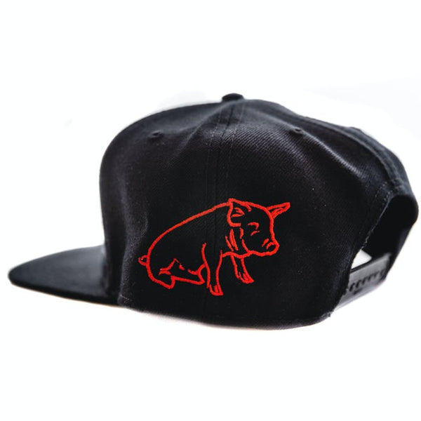 A black baseball hat angled to show the back left and snap adjustment. il porcellino salumi's logo is outlined on the back left of the hat.