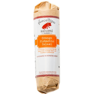 A product photo of il porcellino salumi's Orange Pistachio salami in packaging with a white background.
