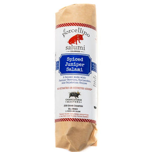A product photo of il porcellino salumi's Spiced Juniper Salami in packaging with a white background.