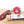 Load image into Gallery viewer, A product photo of il porcellino salumi&#39;s black truffle salami in packaging and cut into slices on a cutting board.
