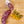 Load image into Gallery viewer, A salami called Orange Pistachio salami pictured from above on a cutting board. One half of the salami chub is cut into slices while the other half remains whole next to pistachios and orange zest.
