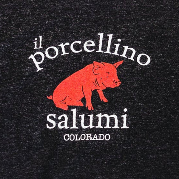 A close up of il porcellino salumi's logo screen printed on a black shirt.